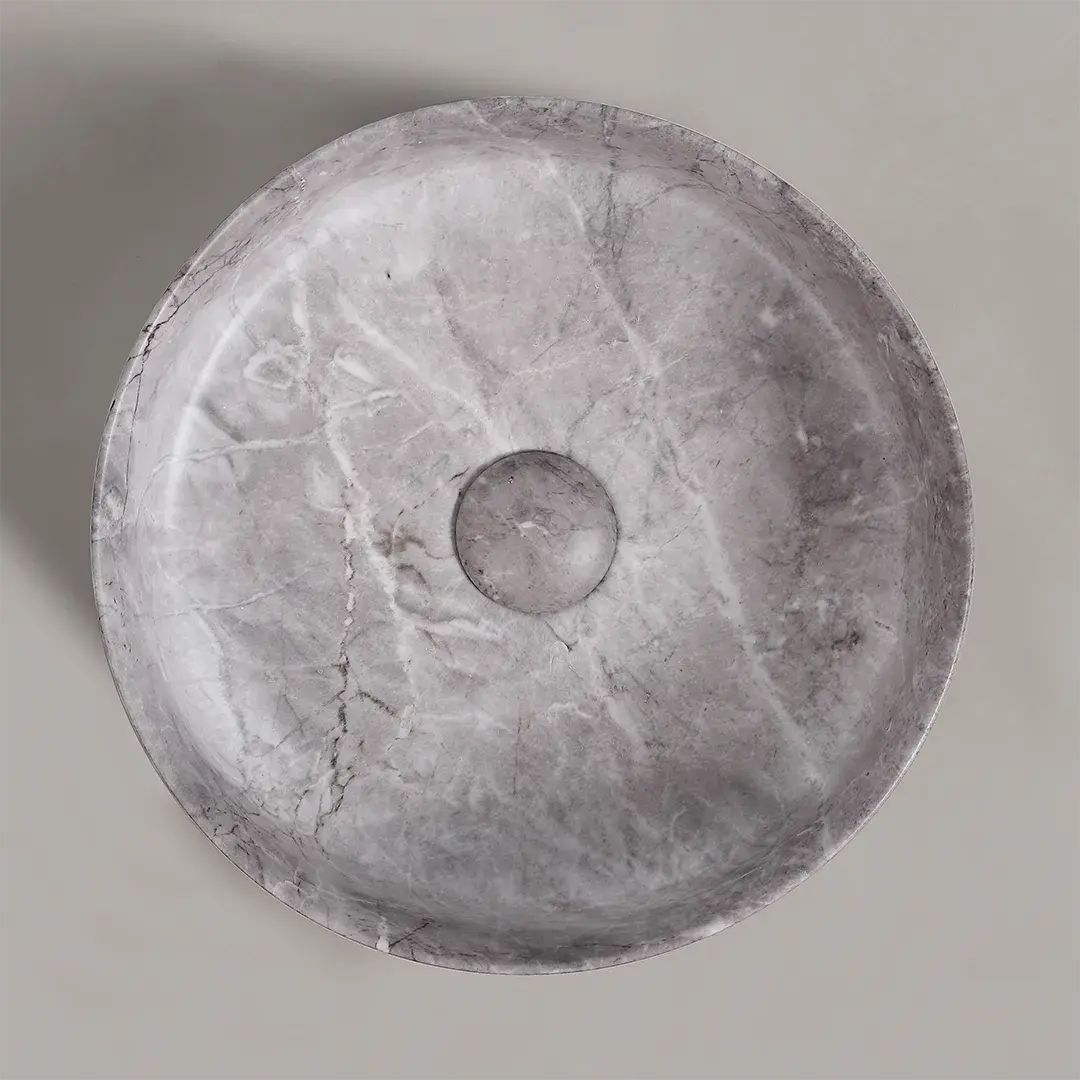 Vasque à poser ronde en céramique effet marbre gris, avec bonde assortie centrée